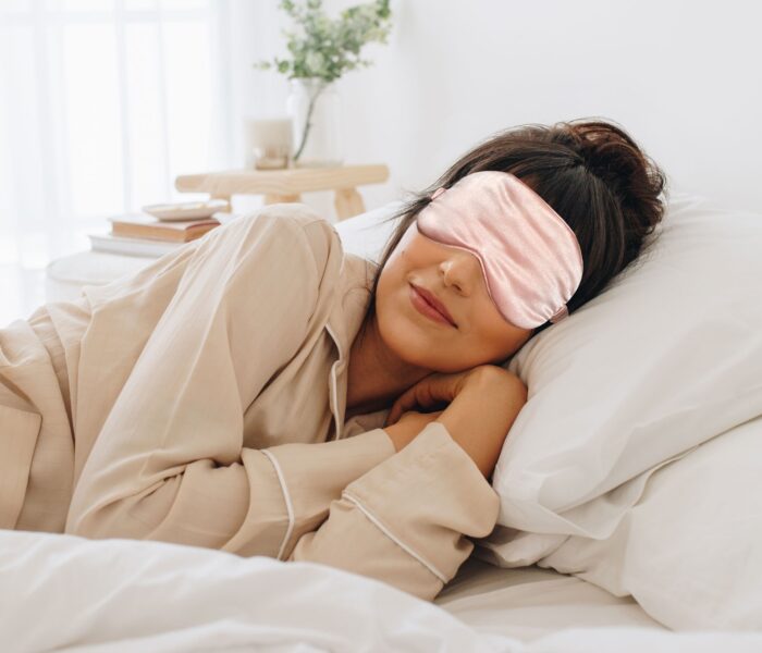Girl wearing pink eye mask