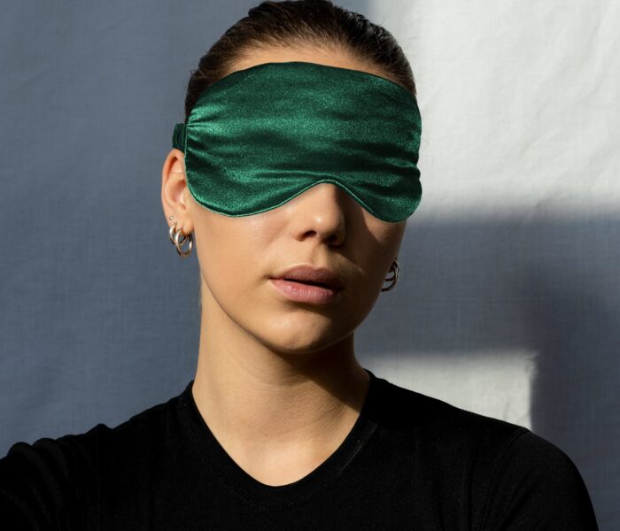 girl wearing emerald green eye mask